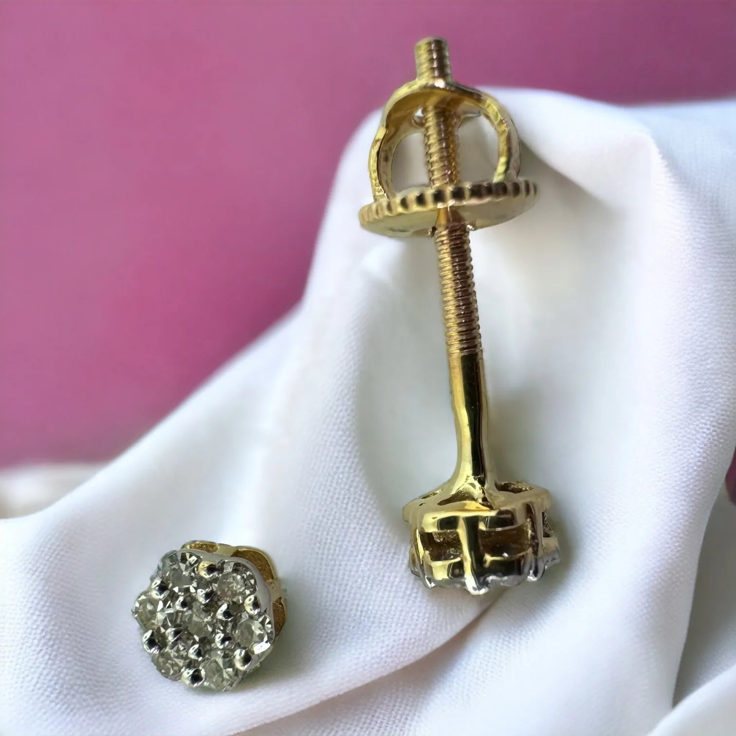 Pair of delicate 10KT yellow gold 3mm flower cluster stud earrings featuring 0.10ct total genuine SI diamonds, front view on soft white background