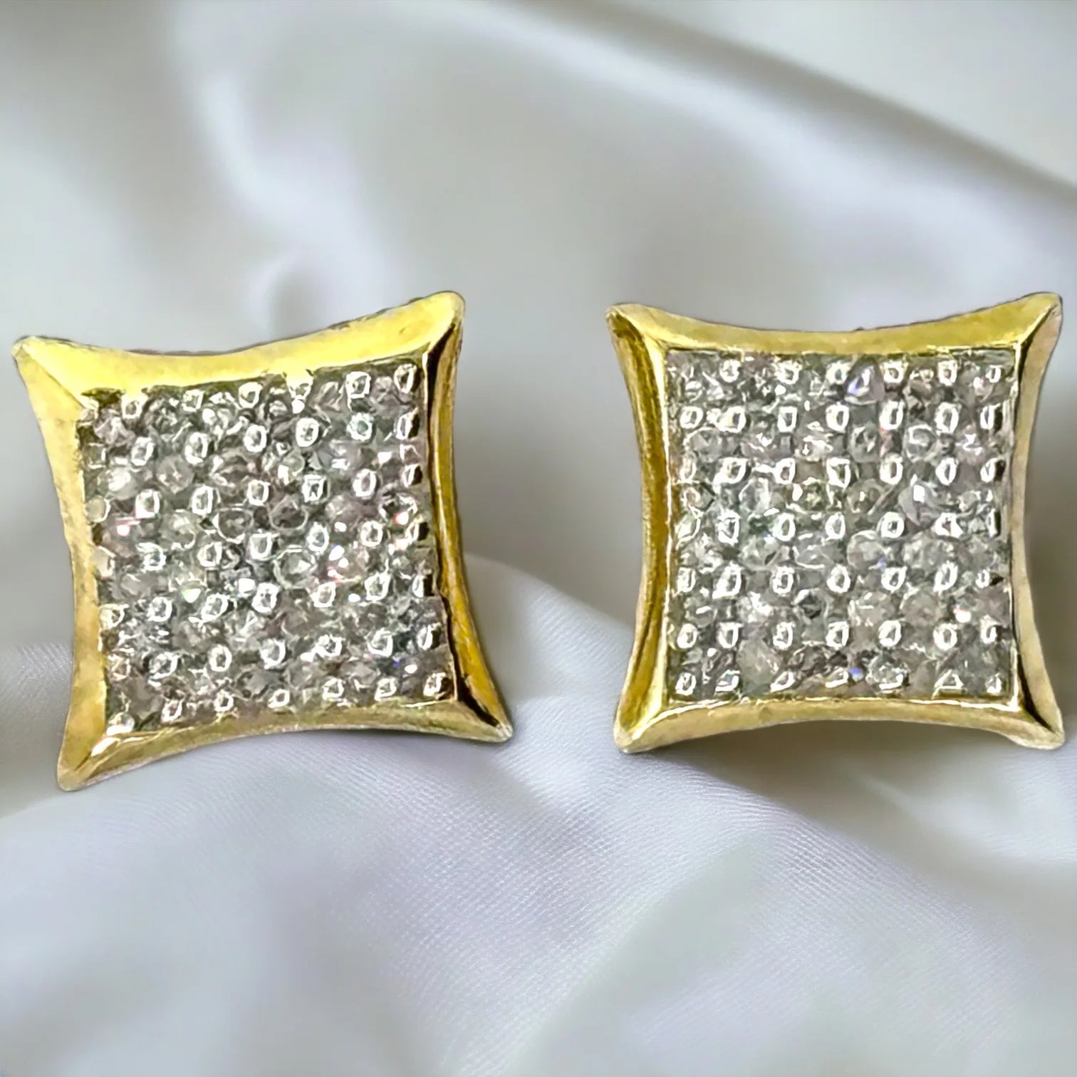 Bold men's 10KT yellow gold 8mm concave square stud earrings fully pave-set with 0.25ct total genuine SI diamonds, front view showcasing intense sparkle on white satin background