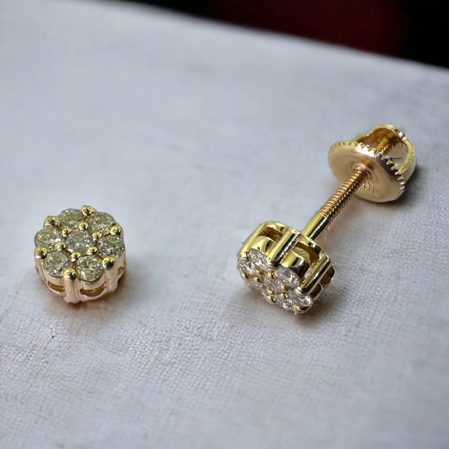 Pair of 10K yellow gold diamond floral stud earrings 0.25ct total weight SI diamonds, 5mm flower cluster design with screw backs