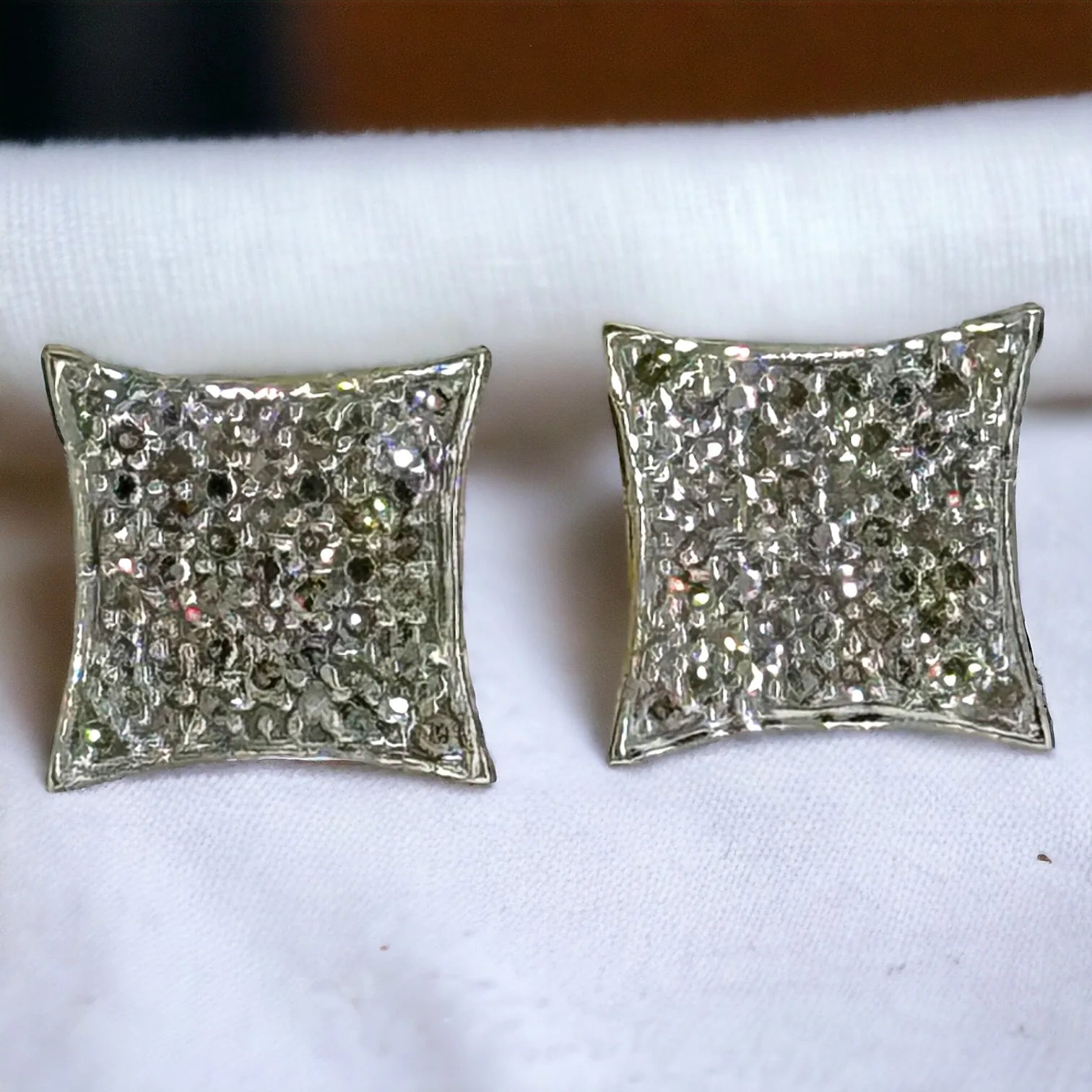 Pair of 10KT gold square diamond stud earrings featuring 0.17ct total SI clarity diamonds with secure screw-back posts, shown from the back on white background