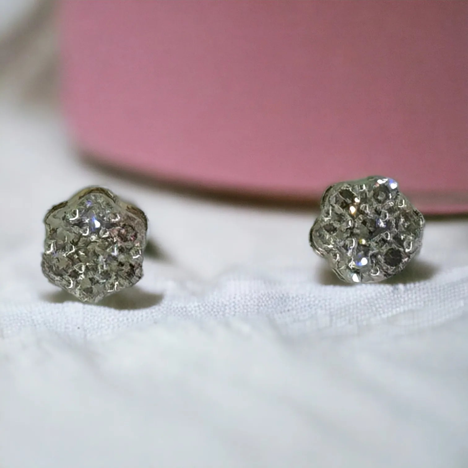 Close-up side and back view of 10KT gold 3mm diamond flower studs showcasing the secure screw-back posts and seven-stone cluster design